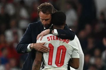 England's coach Gareth Southgate embraces England's forward Raheem Sterling after the UEFA EURO 2020 final football match between Italy and England at the Wembley Stadium.