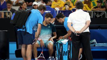 MELBOURNE, AUSTRALIA - JANUARY 17:  Dominic Thiem of Austria receives treatment in his second round match against Alexei Popyrin of Australia during day four of the 2019 Australian Open at Melbourne Park on January 17, 2019 in Melbourne, Australia.  (Photo by Mark Kolbe/Getty Images)