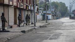 SRINAGAR, KASHMIR INDIA - AUGUST 15: Indian government forces covering their faces with protective face masks stand guard during curfew-like restrictions, as India celebrates its independence day on August 15, 2020 in Srinagar, the summer capital of India