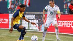 Ecuador&#039;s midfielder Gonzalo Plata (L) defends against Mexico&#039;s midfielder Andres Guardado (R) during the second half of an international friendly football match between Mexico and Ecuador at Soldier Field in Chicago, Illinois June 5, 2022. (Pho