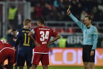Referee Markus Schmidt shows Leipzig's German striker Timo Werner the yellow card during the German first division Bundesliga football match FC Ingolstadt 04.