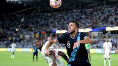 Jul 1, 2023; Houston, Texas, USA; Guatemala midfielder Rodrigo Saravia (8) and Canada defender Richey Laryea (22) pursue a ball off a corner kick during the second half of the CONCACAF Gold Cup group stage match at Shell Energy Stadium. Mandatory Credit: Erik Williams-USA TODAY Sports