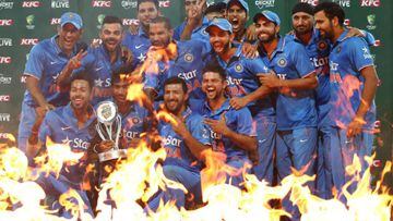 The Indian team pose with the trophy after winning the series 3 - 0 after the third Twenty20 international cricket match between India and Australia in Sydney on January 31, 2016. 