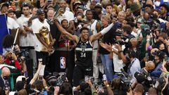 Jul 20, 2021; Milwaukee, Wisconsin, USA; Milwaukee Bucks forward Giannis Antetokounmpo (34) celebrates with the NBA Finals MVP Trophy following the game against the Phoenix Suns following game six of the 2021 NBA Finals at Fiserv Forum. Mandatory Credit: 