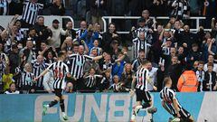 Newcastle United's English defender Dan Burn (R) celebrates with teammates after scoring his team second goal during the English Premier League football match between Newcastle United and Brighton and Hove Albion at St James' Park in Newcastle-upon-Tyne, north east England on May 18, 2023. (Photo by Oli SCARFF / AFP) / RESTRICTED TO EDITORIAL USE. No use with unauthorized audio, video, data, fixture lists, club/league logos or 'live' services. Online in-match use limited to 120 images. An additional 40 images may be used in extra time. No video emulation. Social media in-match use limited to 120 images. An additional 40 images may be used in extra time. No use in betting publications, games or single club/league/player publications. / 