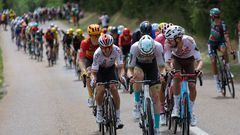 Cofidis' Spanish rider Ion Izaguirre Insausti (L) cycles ahead of the pack of riders during the 19th stage of the 110th edition of the Tour de France cycling race 173 km between Moirans-en-Montagne and Poligny, in the Jura department of central-eastern France, on July 21, 2023. (Photo by Thomas SAMSON / AFP)