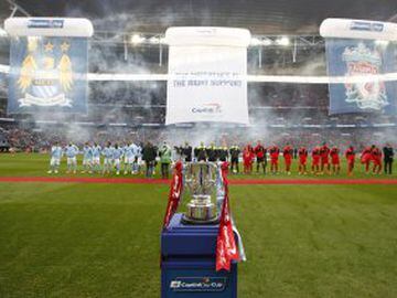 Both teams line up before kick-off, the Capital One trophy on display on the touchline.