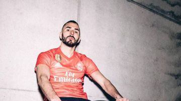Benzema in the coral-coloured green kit made from 100-percent recycled plastic.