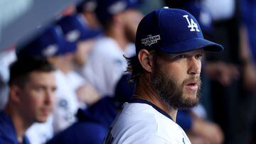 LOS ANGELES, CALIFORNIA - OCTOBER 12: Clayton Kershaw #22 of the Los Angeles Dodgers looks on from the dugout before game two of the National League Division Series against the San Diego Padres at Dodger Stadium on October 12, 2022 in Los Angeles, California.   Harry How/Getty Images/AFP