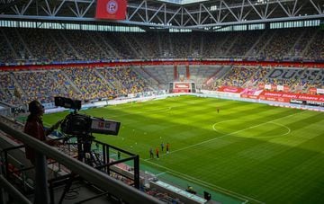 A TV camera operator works prior to the German first division Bundesliga football match Fortuna Dusseldorf v SC Paderborn on May 16, 2020 in Duesseldorf, western Germany as the season resumed following a two-month absence due to the novel coronavirus COVI