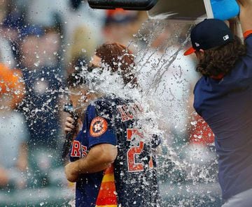 HOUSTON, TEXAS - JULY 11: Lance McCullers Jr. #43 of the Houston Astros dumps water on Jose Altuve after he hit a three run walk off home run in the ninth inning to beat the New York Yankees 8-7 of the Houston Astros at Minute Maid Park on July 11, 2021 i