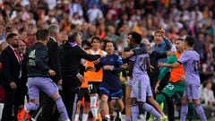 VALENCIA, SPAIN - MAY 21: Players and staff escort Vinicius Junior of Real Madrid off of the pitch after he is shown a red card during the LaLiga Santander match between Valencia CF and Real Madrid CF at Estadio Mestalla on May 21, 2023 in Valencia, Spain. (Photo by Aitor Alcalde/Getty Images)