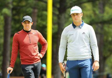 Rory McIlroy of Northern Ireland and Jon Rahm of Spain stand on the first green during the first round of the 2017 Masters.