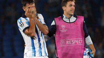 Real Sociedad's Spanish midfielder #04 Martin Zubimendi (L) reacts at the end of the UEFA Champions League 1st round day 1 group D football match between Real Sociedad and Inter Milan at the Reale Arena stadium in San Sebastian on September 20, 2023. (Photo by CESAR MANSO / AFP)