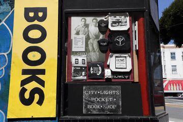 Exterior view of the legendary City Lights Booksellers & Publishers from Jack Kerouac Alley in San Francisco, California, closed around the same time California Governor directed nonessentials businesses to shutter down.