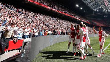 David Neres of Ajax celebrates scoring his teams second goal of the game with team mates during the Dutch Eredivisie match between Ajax Amsterdam and Feyenoord at Amsterdam ArenA on April 2, 2017 in Amsterdam