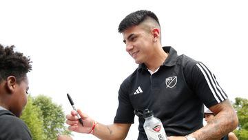 Jul 17, 2023; Washington, D.C., USA; MLS All-Start player Thiago Almada signs autographs for a student at Seaton Elementary School during the MLS WORKS and BODYARMOR community day before the 2023 MLS All Star Game at Seaton Elementary School. Mandatory Credit: Amber Searls-USA TODAY Sports