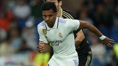 Real Madrid's Brazilian forward Rodrygo (R) controls the ball during the Spanish league football match between Real Madrid CF and RC Celta de Vigo at the Santiago Bernabeu stadium in Madrid on April 22, 2023. (Photo by Thomas COEX / AFP)