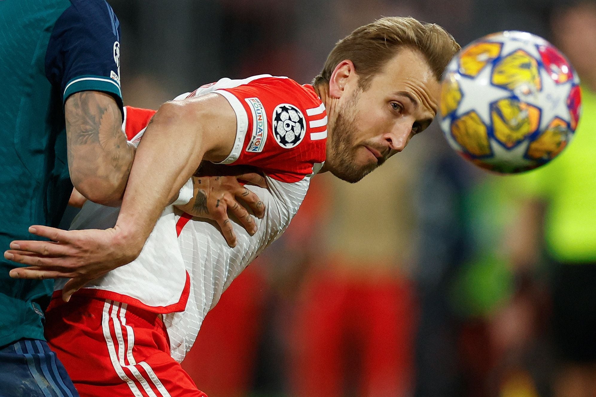Bayern Munich's English forward #09 Harry Kane eyes the ball during the UEFA Champions League quarter-final second leg football match between FC Bayern Munich and Arsenal FC in Munich, southern Germany on April 17, 2024. (Photo by Odd ANDERSEN / AFP)
