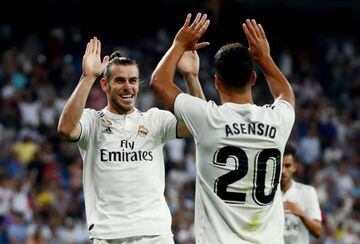 Bale celebrates scoring Real Madrid's second goal against Getafe with Marco Asensio.