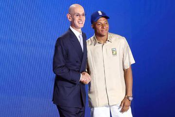 NBA commissioner Adam Silver (L) and Kylian Mbappe