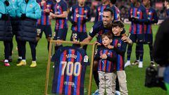 (FILES) In this file photo taken on January 22, 2023 Barcelona's Spanish midfielder Sergio Busquets poses for pictures with a jersey reading "700" after playing more than 700 matches with FC Barcelona, before the start of the Spanish league football match between FC Barcelona and Getafe CF at the Camp Nou stadium in Barcelona. Sergio Busquets will leave Barcelona in June at the end of his contract, the midfielder confirmed on May 9, 2023 ending a highly successful era at the club. The 34-year-old was a central figure in Barcelona's golden era winning a host of trophies including the Champions League three times. (Photo by Josep LAGO / AFP)