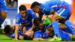 Jose Rivero (down, C) of Cruz Azul celebrates with teammates after scoring goal against Leon during their Mexican Apertura 2022 tournament playoff football match at Azteca Stadium in Mexico City, on October 8, 2022. (Photo by CLAUDIO CRUZ / AFP)