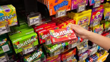A new law could pull popular candies, including, Skittles, Pez, and Sour Patch Kids, from store shelves in California. What is motivating the possible ban?
