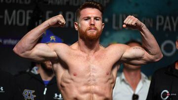 LAS VEGAS, NV - SEPTEMBER 15:  Boxer Canelo Alvarez poses on the scale during his official weigh-in at MGM Grand Garden Arena on September 15, 2017 in Las Vegas, Nevada.  Alvarez will challenge WBC, WBA and IBF middleweight champion Gennady Golovkin for his titles at T-Mobile Arena on September 16 in Las Vegas.  (Photo by Ethan Miller/Getty Images)