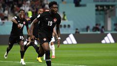Canada's forward #19 Alphonso Davies celebrates scoring his team's first goal during the Qatar 2022 World Cup Group F football match between Croatia and Canada at the Khalifa International Stadium in Doha on November 27, 2022. (Photo by OZAN KOSE / AFP)