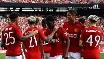 Manchester United's English midfielder Jadon Sancho (L) celebrates scoring his team's first goal with teammates during the friendly football match between Manchester United and Arsenal at MetLife Stadium in East Rutherford, New Jersey, on July 22, 2023. (Photo by Leonardo Munoz / AFP)