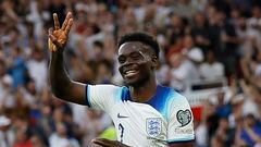 Soccer Football - UEFA Euro 2024 Qualifier - Group C - England v North Macedonia - Old Trafford, Manchester, Britain - June 19, 2023 England's Bukayo Saka celebrates scoring their fifth goal and his hat-trick Action Images via Reuters/Jason Cairnduff