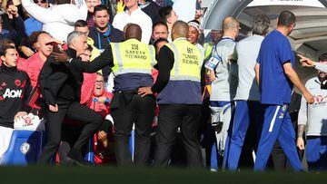 LONDON, ENGLAND - OCTOBER 20: Stewards hold back Jose Mourinho, Manager of Manchester United as he clashes with the Chelsea backroom staff during the Premier League match between Chelsea FC and Manchester United at Stamford Bridge on October 20, 2018 in L