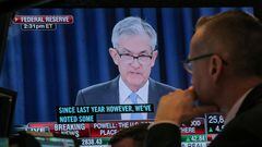 FILE PHOTO: A trader watches U.S. Federal Reserve Chairman Jerome Powell on a screen during a news conference following the two-day Federal Open Market Committee (FOMC) policy meeting, on the floor at the New York Stock Exchange (NYSE) in New York, U.S., March 20, 2019. REUTERS/Brendan McDermid/File Photo