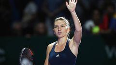 SINGAPORE - OCTOBER 23:  Simona Halep of Romania celebrates victory in her singles match against Madison Keys of the United States during day 1 of the BNP Paribas WTA Finals Singapore at Singapore Sports Hub on October 23, 2016 in Singapore.  (Photo by Julian Finney/Getty Images)