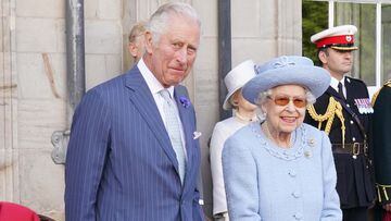Prince of Wales and Queen Elizabeth II attending the Queen's Body Guard for Scotland (also known as the Royal Company of Archers) Reddendo Parade in the gardens of the Palace of Holyroodhouse, Edinburgh, in June 2022.