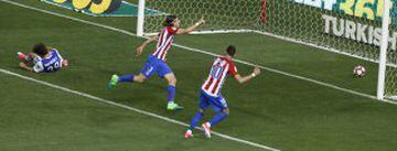 Filipe Luis wheels away with the ball in the net