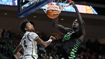 Mar 28, 2023; Las Vegas, Nevada, USA; Utah Valley Wolverines center Aziz Bandaogo (55) dunks the ball against UAB Blazers guard Eric Gaines (4) in the first half at Orleans Arena. Mandatory Credit: Candice Ward-USA TODAY Sports