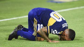 BUENOS AIRES, ARGENTINA - MARCH 07: Carlos Tevez of Boca Juniors celebrates after scoring the first goal of his team as he kisses the pitch during a match between Boca Juniors and Gimnasia as part of Superliga 2019/20 at Estadio Alberto J. Armando on Marc
