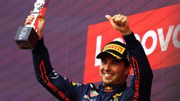 NORTHAMPTON, ENGLAND - JULY 03: Second placed Sergio Perez of Mexico and Oracle Red Bull Racing celebrates on the podium during the F1 Grand Prix of Great Britain at Silverstone on July 03, 2022 in Northampton, England. (Photo by Mark Thompson/Getty Images)