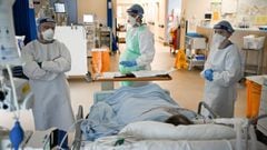 AIRDRIE, SCOTLAND - FEBRUARY 05: Staff at University Hospital Monklands attend to a Covid-positive patient on the ICU ward on February 5, 2021 in Airdrie, Scotland. The numbers of patients with Coronavirus at Lanarkshire hospitals hit record levels during