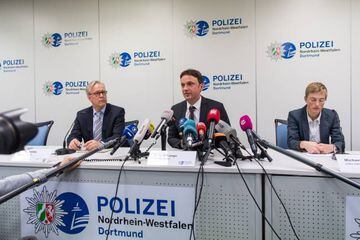 Gregor Lange, chief of Police Dortmund, Sascha Fligge, press officer of Borussia Dortmund and Sandra Luecke, public prosecutor, speak to the media.