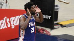 Philadelphia 76ers center Joel Embiid (21) gestures to the crowd after his dunk during the first half of Game 3 in a first-round NBA basketball playoff series against the Washington Wizards, Saturday, May 29, 2021, in Washington. (AP Photo/Nick Wass)