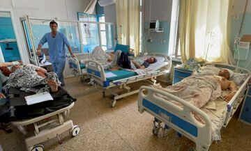 Wounded Afghan men receive treatment at a hospital after yesterday's explosions outside airport in Kabul, Afghanistan August 27, 2021.
