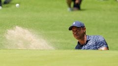 May 19, 2022; Tulsa, Oklahoma, USA; Tiger Woods plays a shot from the bunker on the seventh green during the first round of the PGA Championship golf tournament. Mandatory Credit: Michael Madrid-USA TODAY Sports