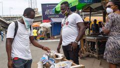 A man sells face masks after the partial lockdown in parts of Ghana to halt the spread of the COVID-19 coronavirus was lifted in Accra, Ghana on April 20, 2020. - The streets of Accra buzzed with life following President Nana Akufo-Addo&#039;s announcemen