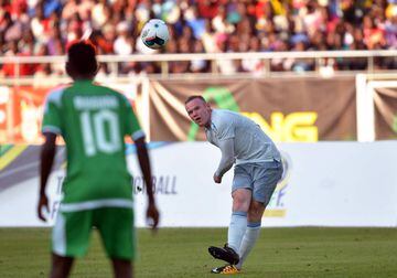Wayne Rooney strikes the ball.