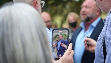 Alex Jones steps outside of the Travis County Courthouse, to do interviews with media after he was questioned under oath.