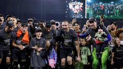 LOS ANGELES, CALIFORNIA - DECEMBER 02: Giorgio Chiellini #14 of Los Angeles FC holds up the trophy while using a bullhorn to speak to fans, surrounded by teammates and family, in celebration of a 2-0 win over the Houston Dynamo in the Western Conference Final at BMO Stadium on December 02, 2023 in Los Angeles, California.   Harry How/Getty Images/AFP (Photo by Harry How / GETTY IMAGES NORTH AMERICA / Getty Images via AFP)