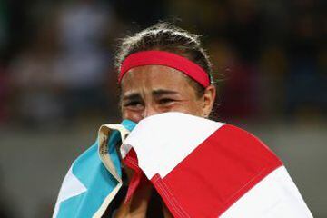 Monica Puig of Puerto Rico reacts after defeating Angelique Kerber of Germany in the Women's Singles Gold Medal Match on Day 8 of the Rio 2016 Olympic Games at the Olympic Tennis Centre on August 13, 2016 in Rio de Janeiro, Brazil. Puig defeated Kerber 6-